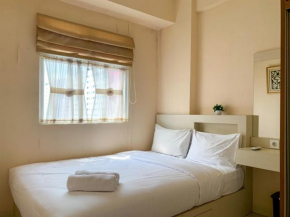 Modern Look and Comfortable 2BR Green Pramuka City Apartment By Travelio